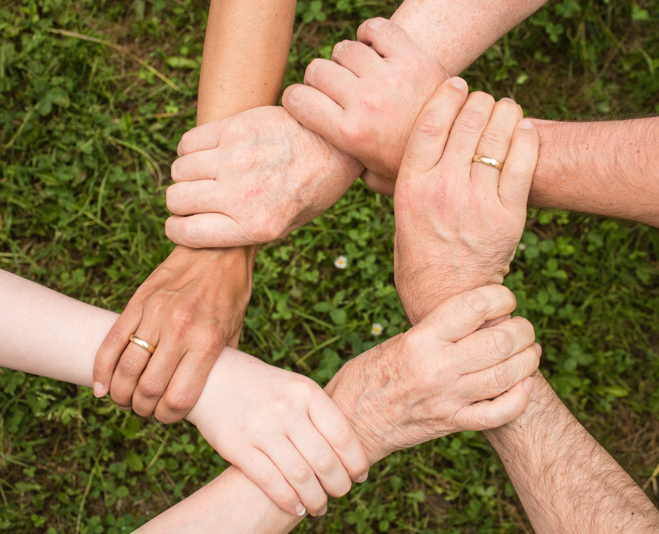 Team Putting Their Hands Together